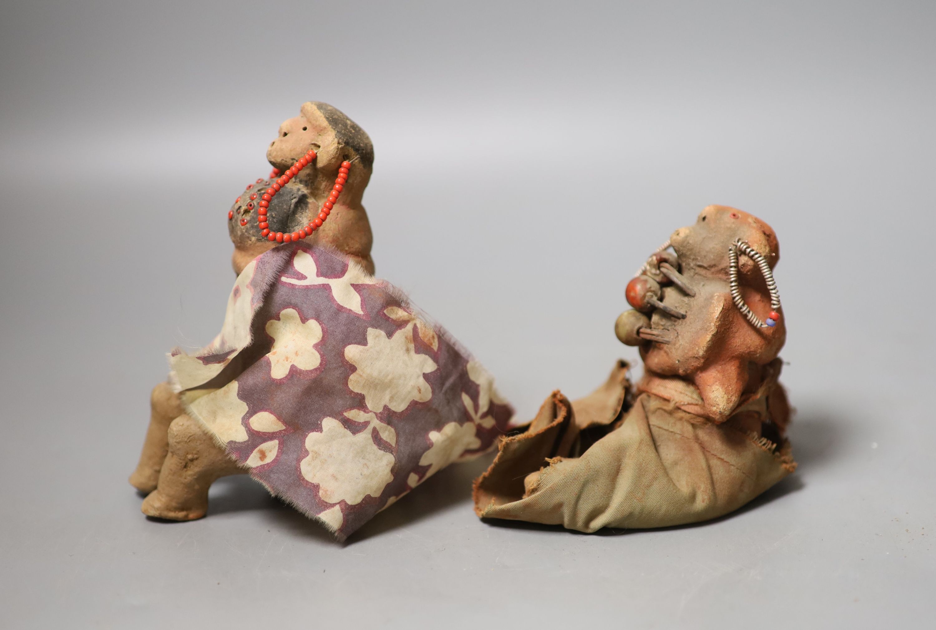 2 Tanzanian terracotta cloth and beadwork medicine or witch doctor figures-  Provenance- vendors parents bought figures in Nairobi in